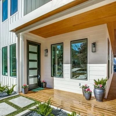Modern custom home with landscaped backyard